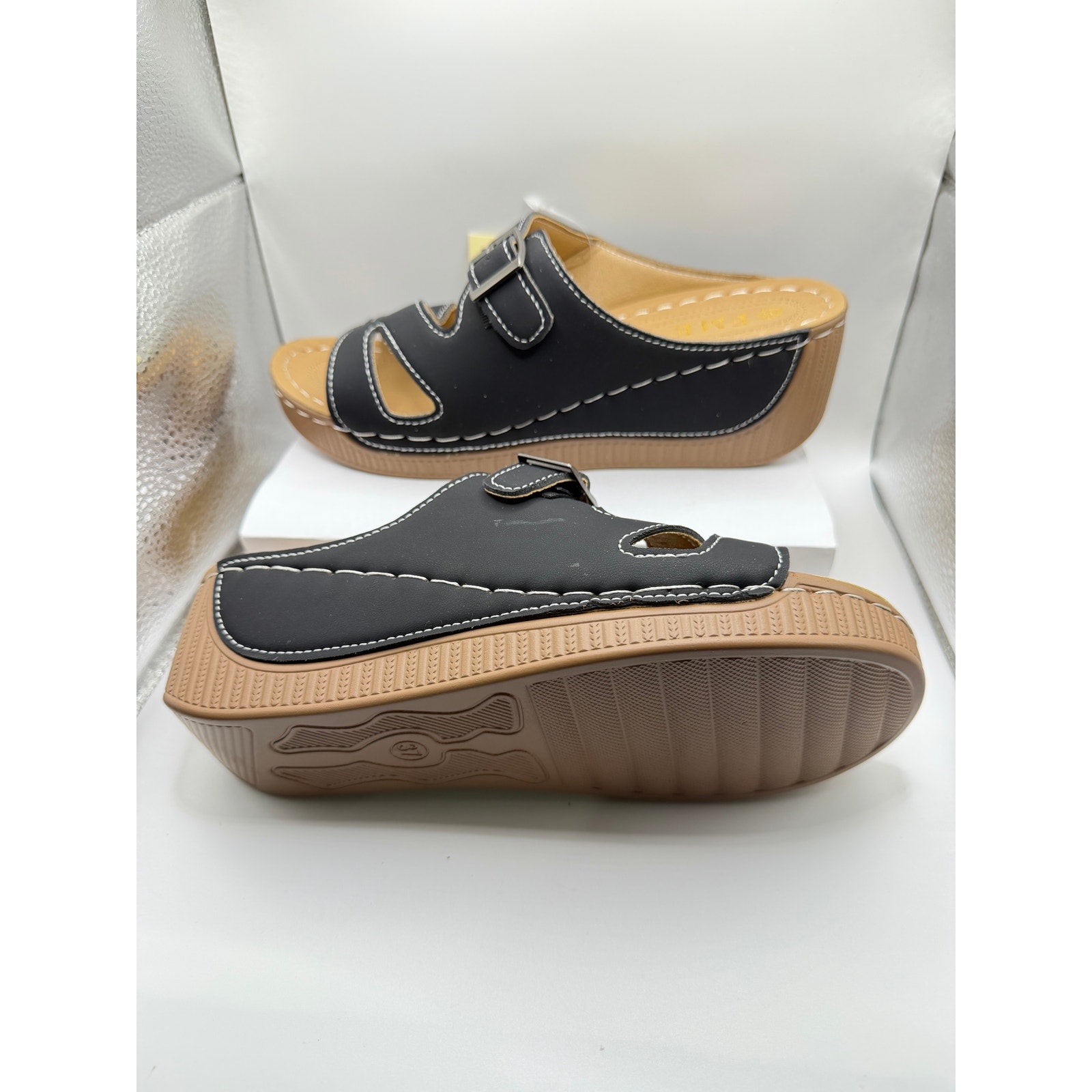 FME Comfort Slide Sandals in black with buckle details, size 7 (EU 37), featuring a casual slip-on design and open toe style.