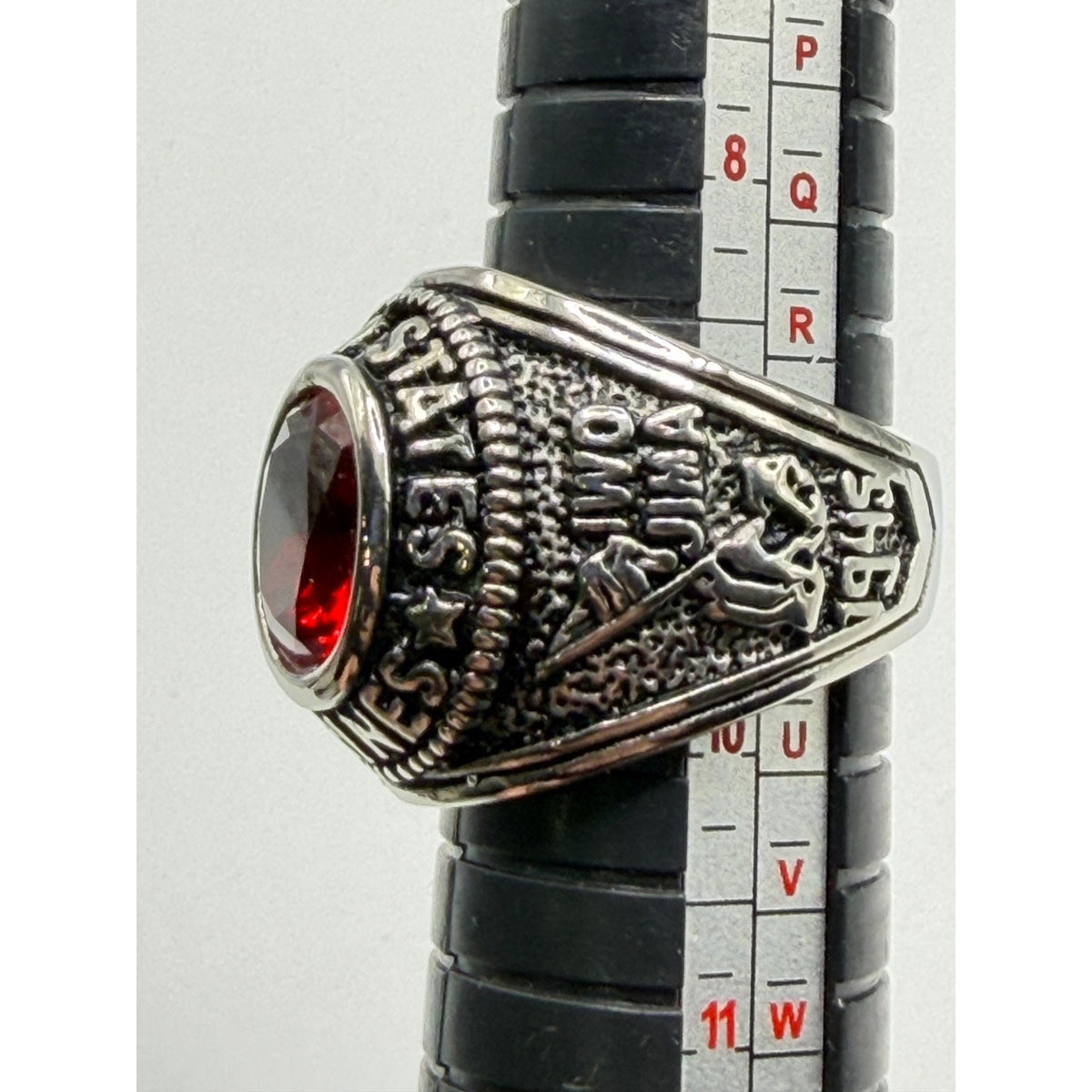 Men's US Marine Corps signet ring in silver with red accents, size 9, featuring engraved Marine emblem and detailed design.