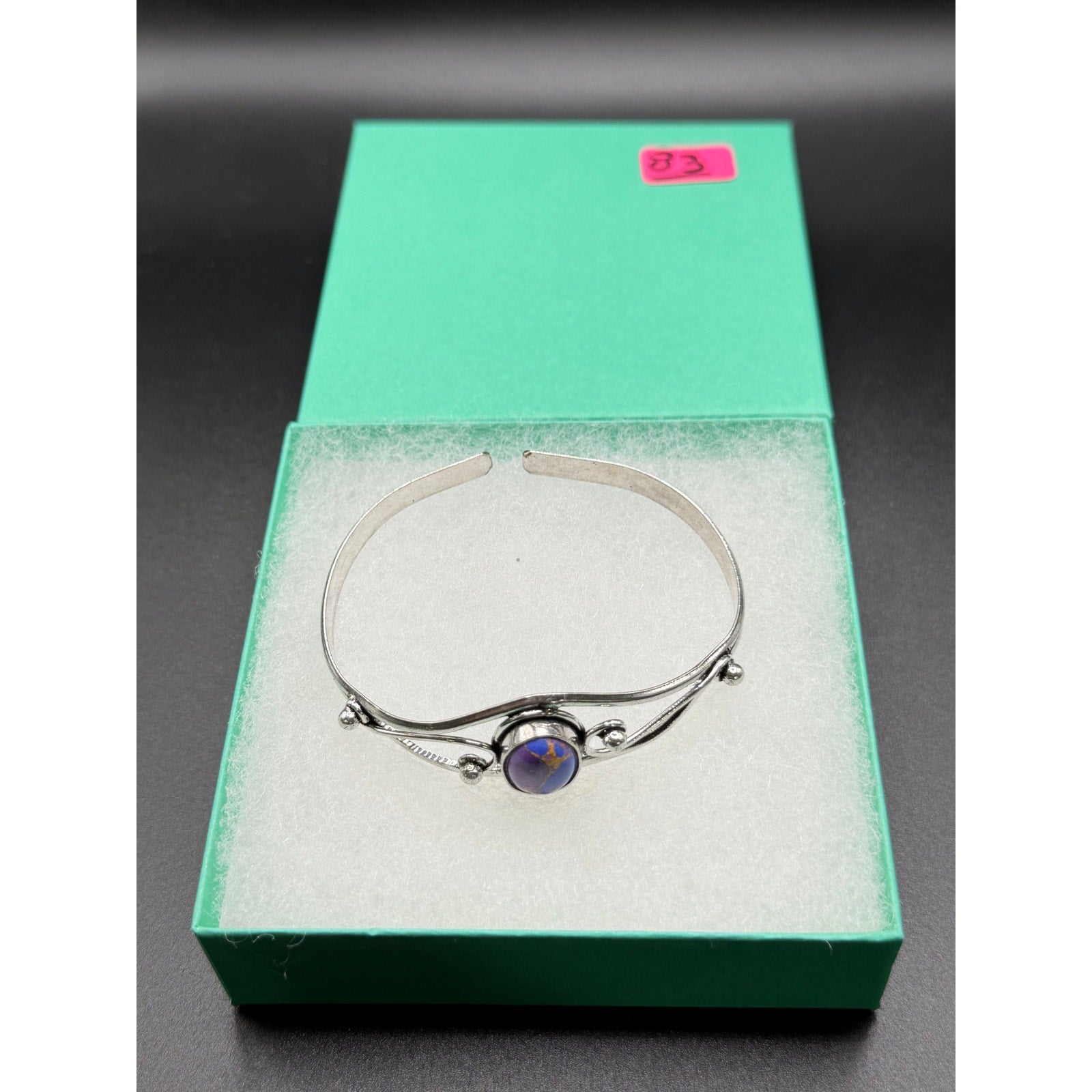 Silver plated bangle gemstone bracelet with handcrafted design from Republic Mercantile, featuring colorful gemstone accents.