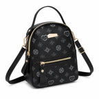 Black Aohao heart-shaped crossbody faux leather backpack with zipper closure and adjustable strap.