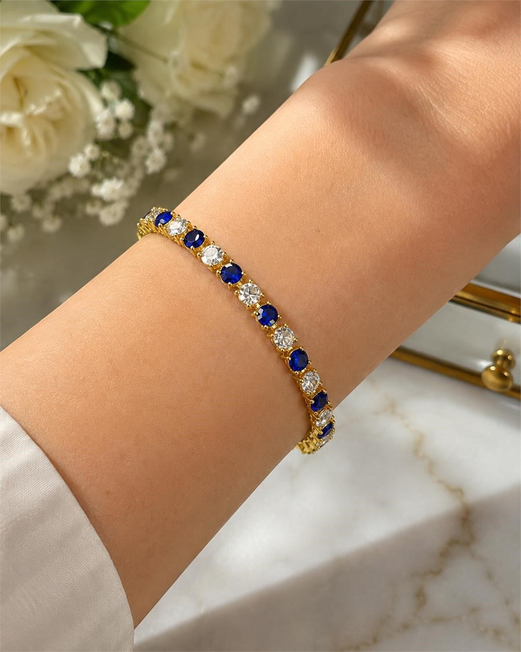Blue and white gem bracelet set in gold tone featuring multiple beaded bracelets with shiny gemstone accents.