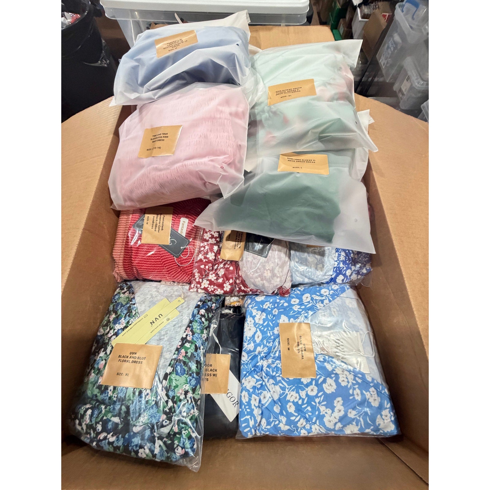 50-piece wholesale box of new women's dresses by Republic Mercantile, featuring assorted styles in a 36lb lot.
