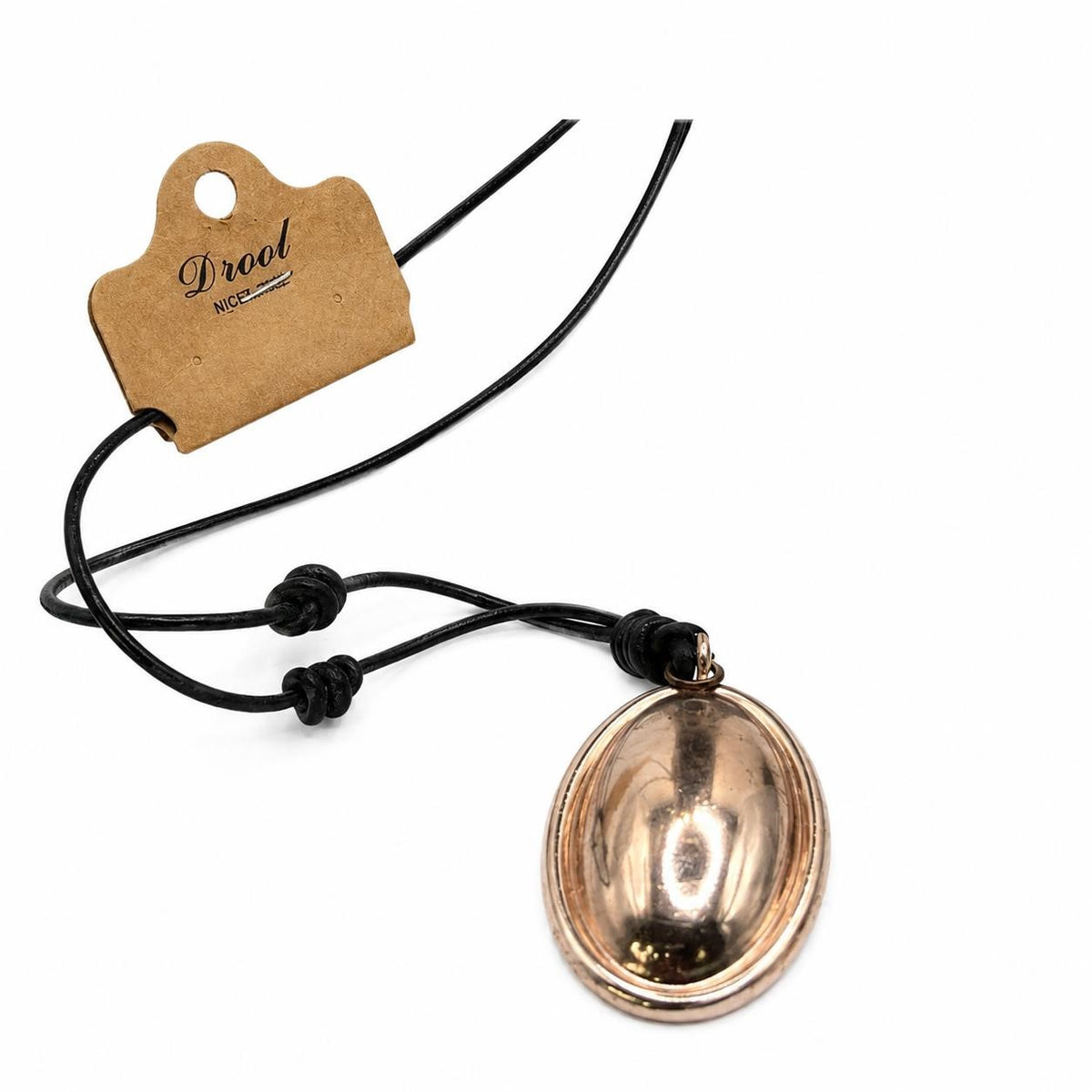 Drool rope necklace by Republic Mercantile featuring a copper pendant, shown with the necklace draped and the pendant prominently displayed.