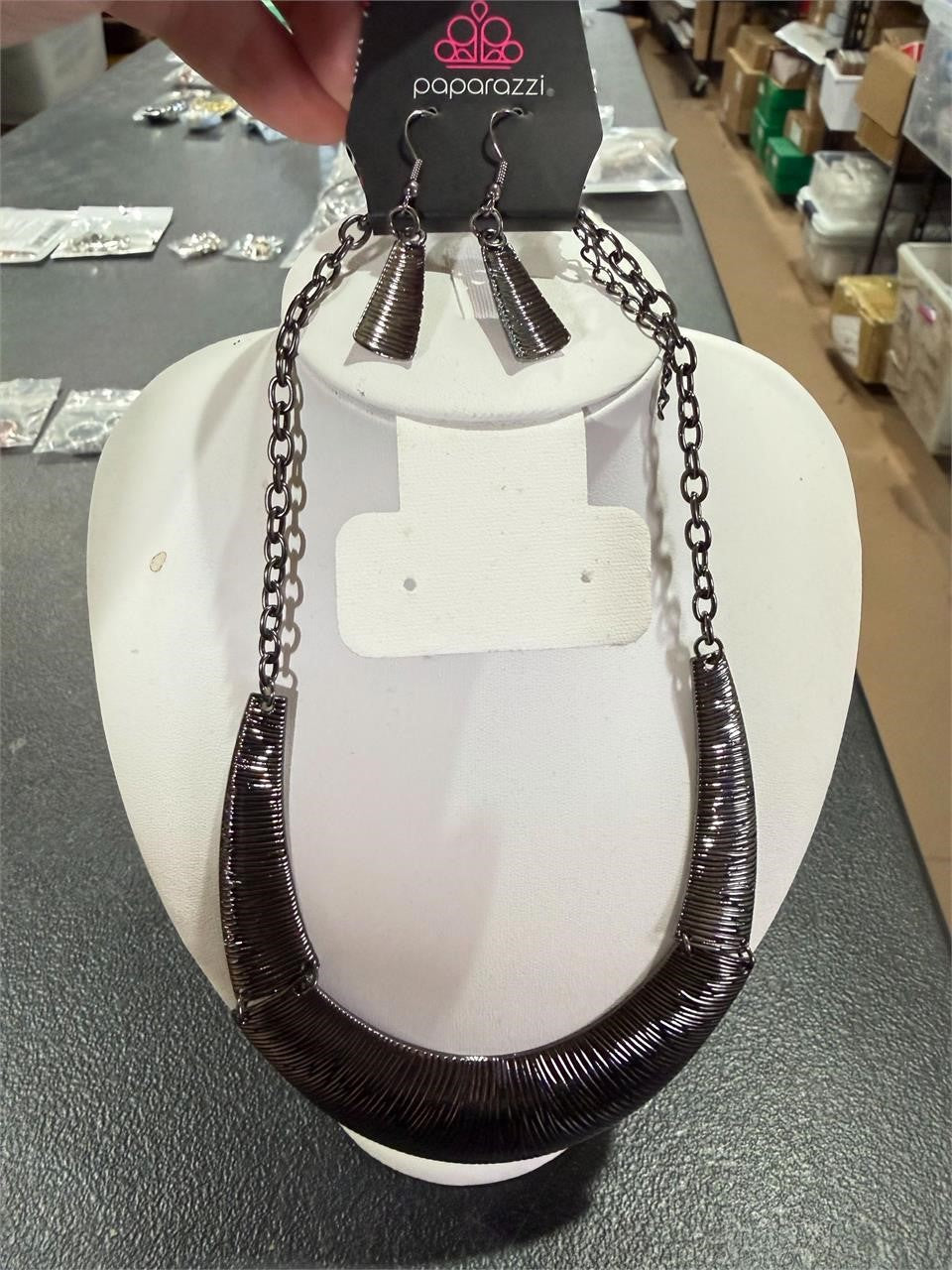 Paparazzi necklace and earring set with silver-tone jewelry featuring layered chain design and stylish accents.