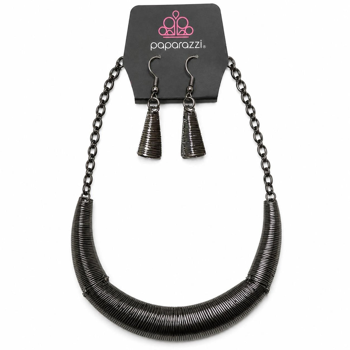 Paparazzi necklace and earring set with layered silver chains and dangling earrings, styled for a trendy look.