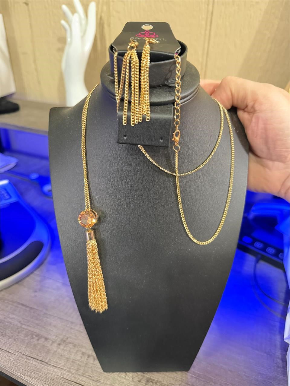 Gold chain with gem pendant and matching earrings from Republic Mercantile, styled for a sophisticated look.