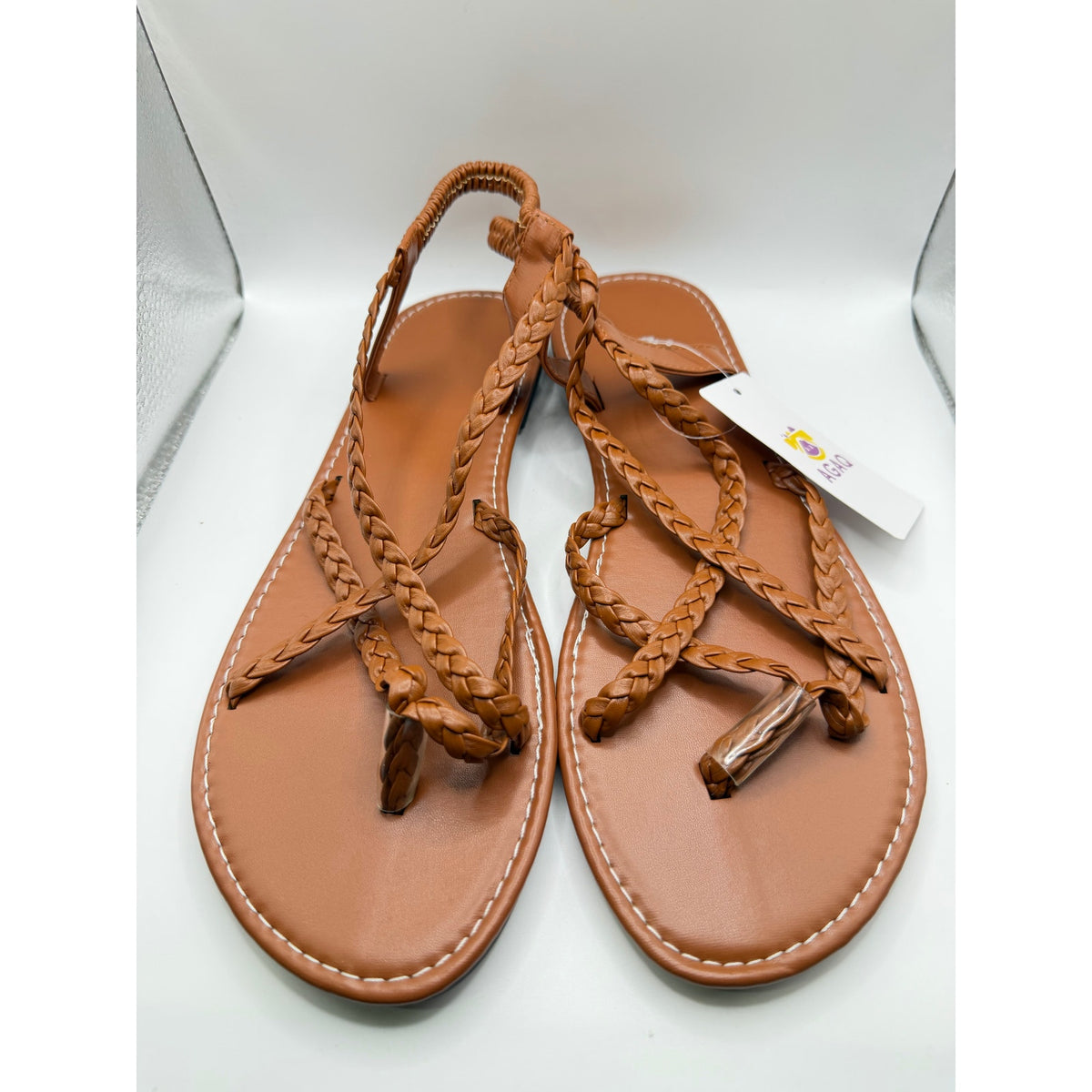 Agaq brown leather braided strap sandals in size 11 (EU 42) with open toe design and flat sole, stylish for casual wear.