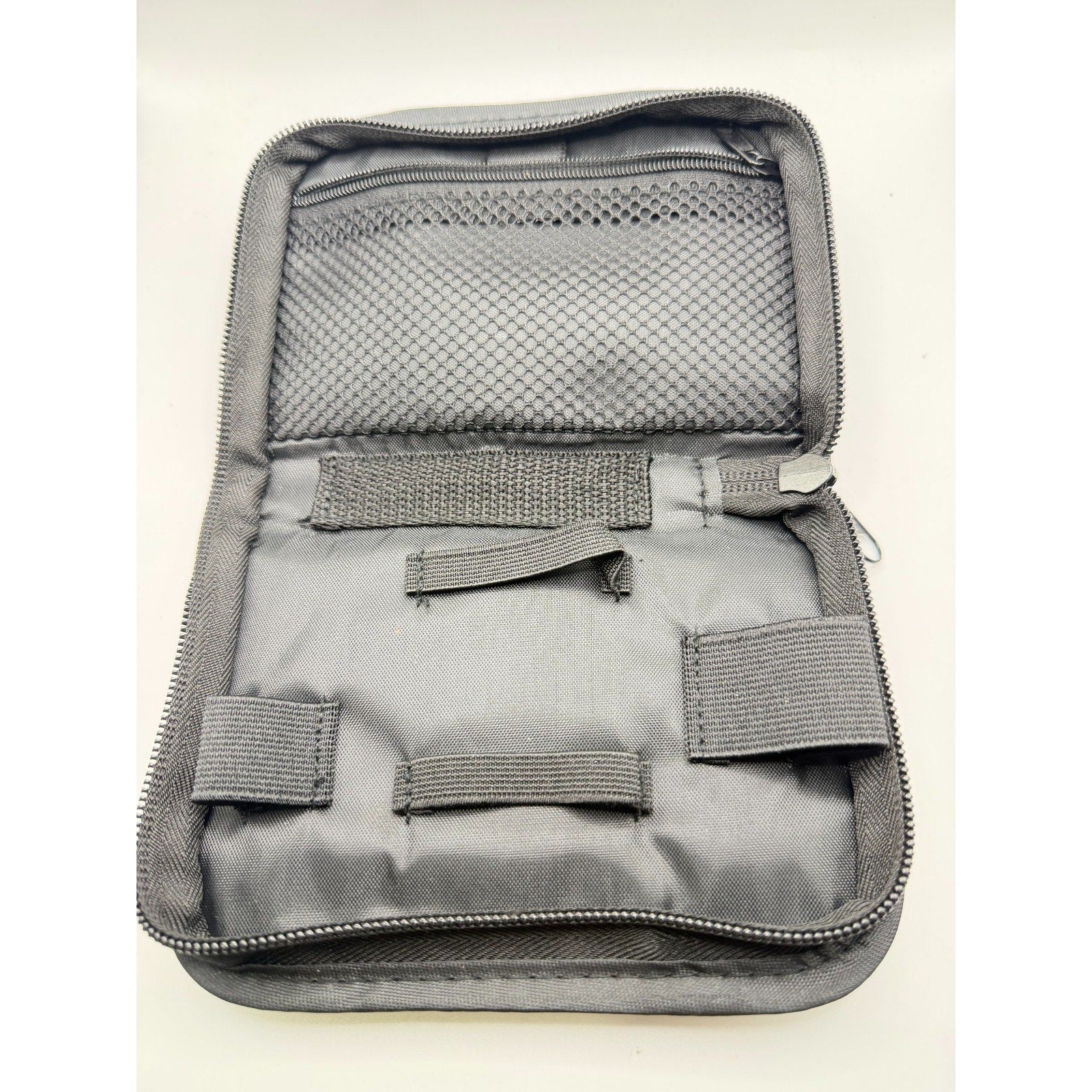 Empty HouseVibe compact travel organizer case for medical supplies, with multiple compartments for organization.