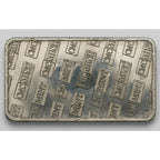 Close-up of a 1 Troy oz .999 Tin Collectible Bar by CMC Mint, showcasing the detailed engraved design on the silver bar.