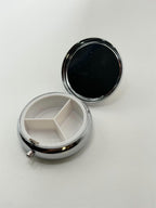 Decorative flower garden pill box by Republic Mercantile featuring colorful floral design and compact storage.
