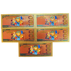 Set of five gold-foil novelty notes from Republic Mercantile featuring shiny, decorative paper currency with playful design elements.