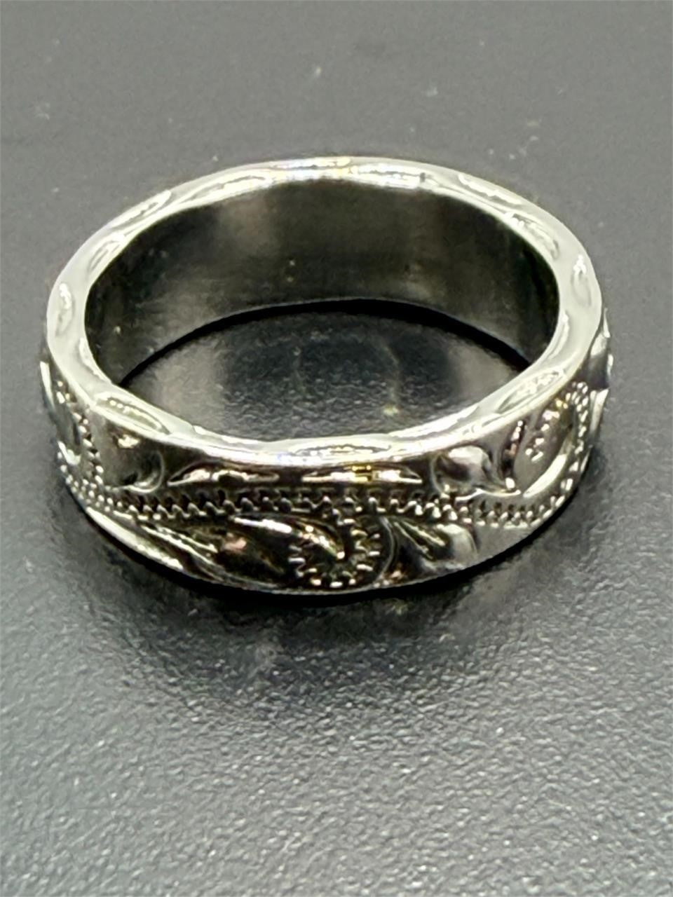 Carved silver men's ring in size 9 by Republic Mercantile with intricate engraved details and a polished finish.