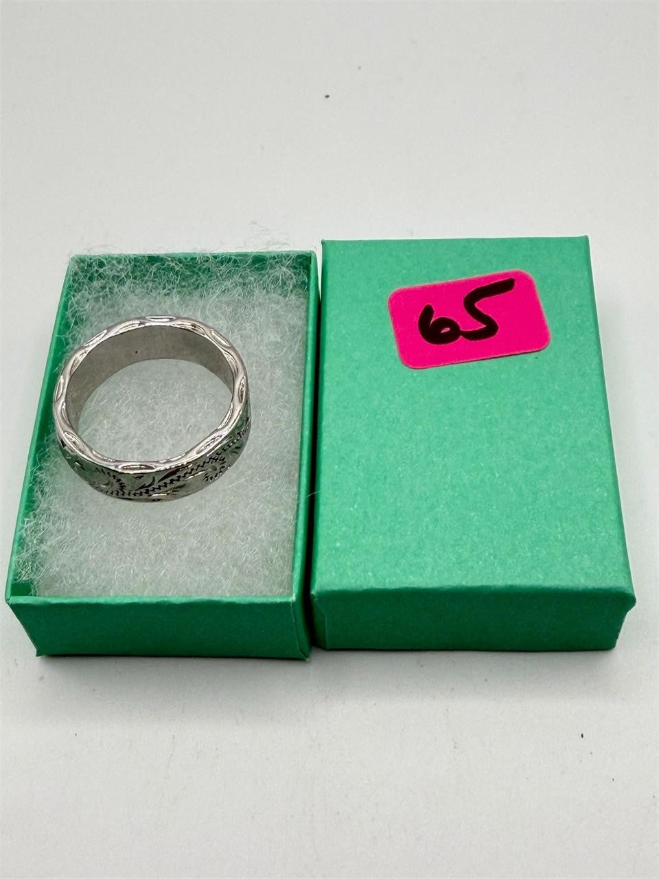Carved silver men's ring in size 9 with intricate design, featuring Republic Mercantile branding and detailed craftsmanship.