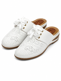 Ecetana white wedge mule sandals in size 9.5 with open toe and slip-on design, featuring a comfortable wedge heel.