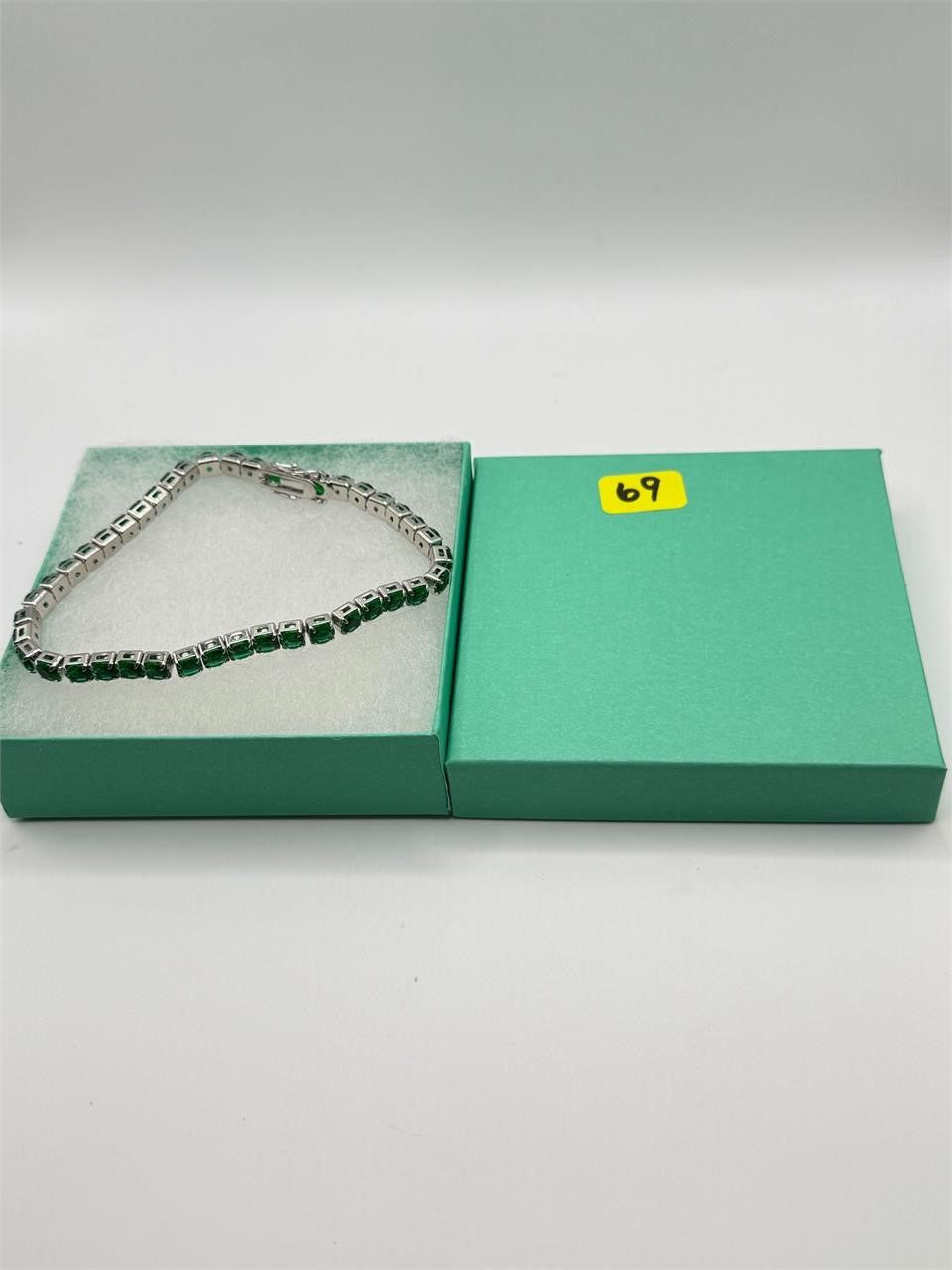 Silver tone women's bracelet featuring a beautiful green gemstone, stylish accessory from Republic Mercantile.