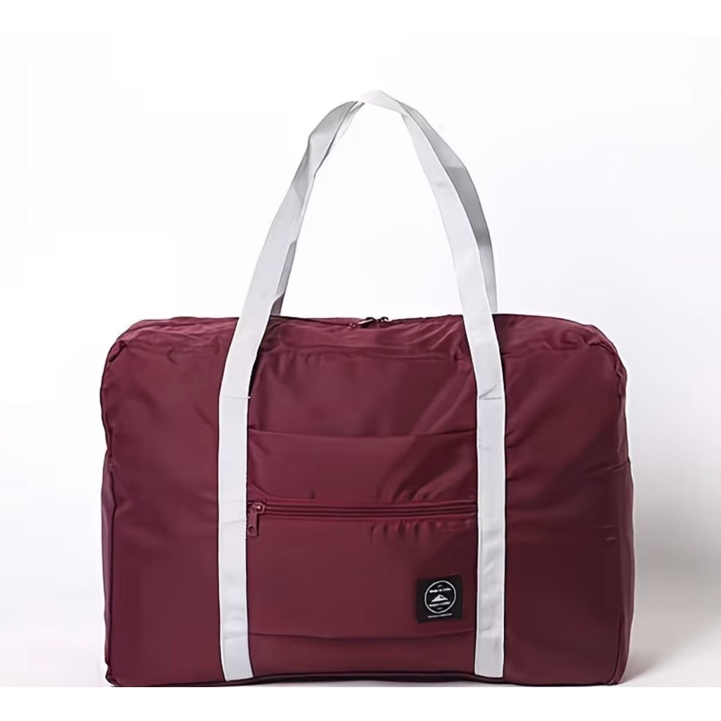 Nice Travel burgundy 11" x 16.5" travel tote bag with handles, showing its spacious interior and stylish design.