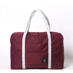 Nice Travel burgundy 11" x 16.5" travel tote bag with handles, showing its spacious interior and stylish design.