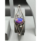 Silver plated bangle gem bracelet from Republic Mercantile, showcasing intricate handcrafted design with sparkling gemstones.