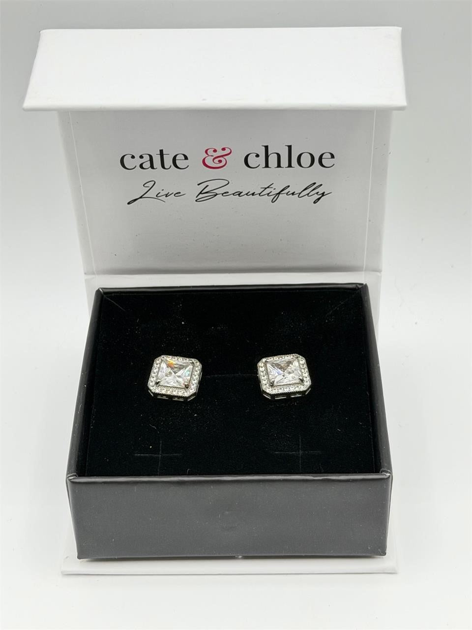 Cate & Chloé 1 ct cubic zirconia diamond stud earrings featuring sparkling clear stones and silver-tone metal setting.