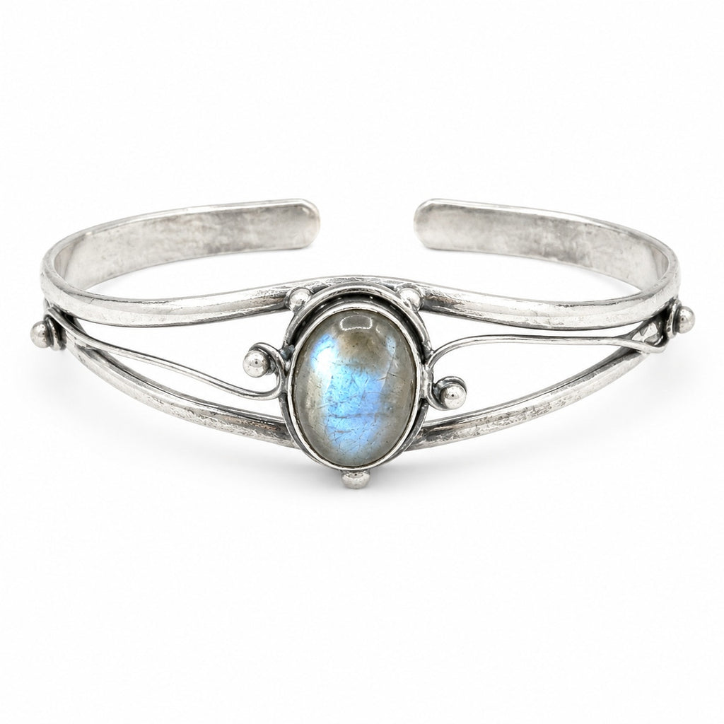 Silver plated bangle with embedded gemstones, handcrafted jewelry by Republic Mercantile featuring intricate details and a polished finish.