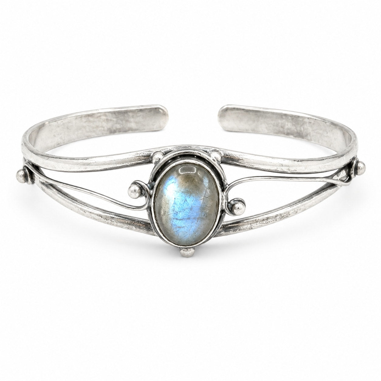 Silver plated bangle with embedded gemstones, handcrafted jewelry by Republic Mercantile featuring intricate details and a polished finish.