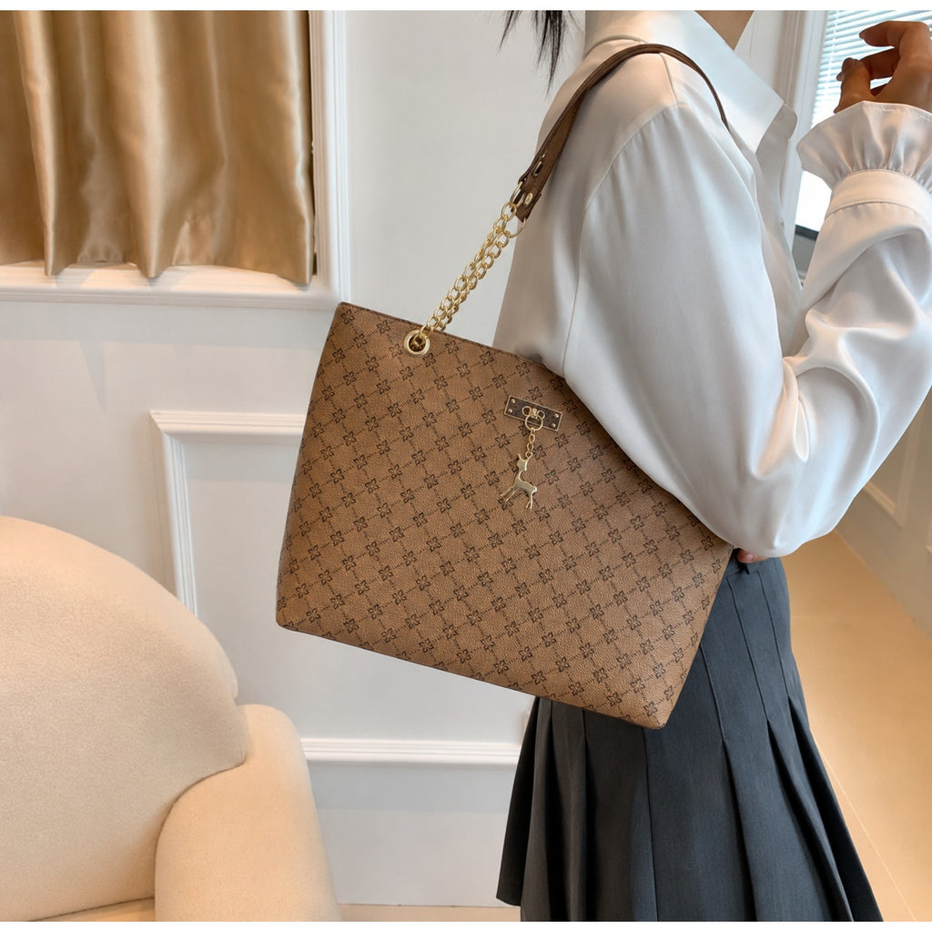 Sandglass women's casual shoulder tote bag in tan with gold accents, featuring a spacious design and stylish handles.