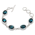 Sterling silver bracelet with London Blue Oval Topaz gemstone, plated jewelry by Republic Mercantile, showcasing elegant blue gemstone.