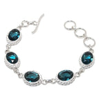 Sterling silver bracelet with London Blue Oval Topaz gemstone, plated jewelry by Republic Mercantile, showcasing elegant blue gemstone.