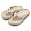 Busylion beige unisex slip-on comfort slides in size 9.5 men's, featuring a casual design and cushioned sole.