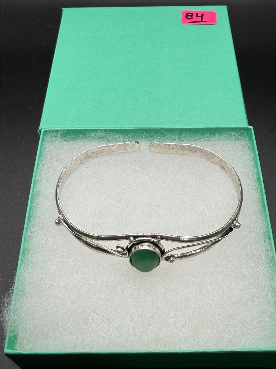 Silver plated bangle bracelet with embedded colorful gemstones, handcrafted by Republic Mercantile.