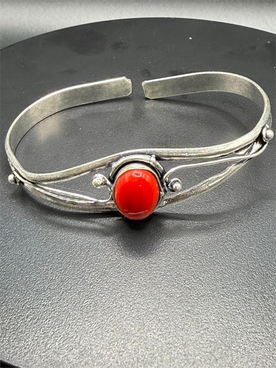 Silver plated bangle bracelet with embedded gemstones, handcrafted by Republic Mercantile, featuring a sleek, elegant design.