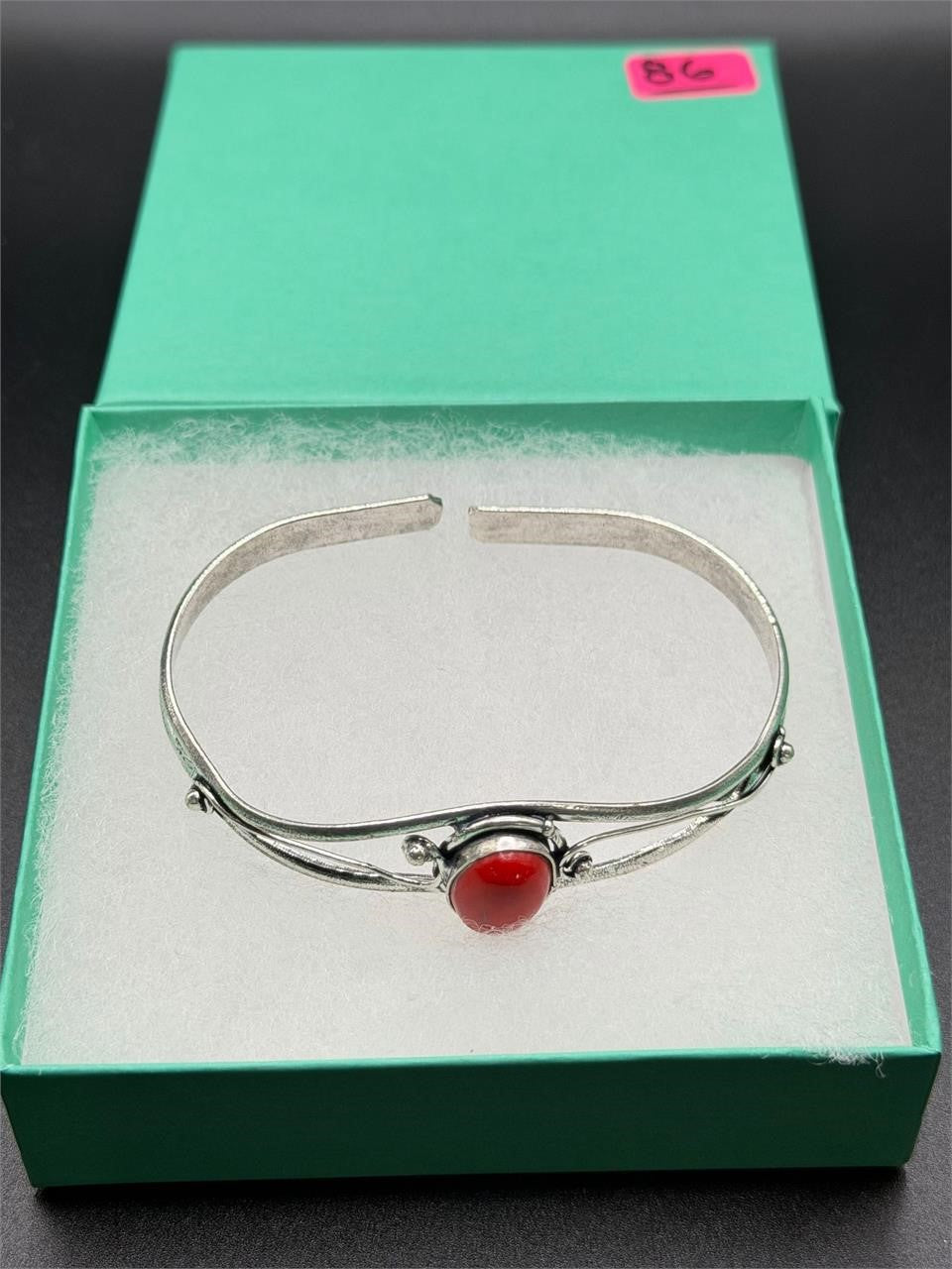 Silver plated bangle gem bracelet with handcrafted design, featuring intricate details and vibrant gemstones from Republic Mercantile.
