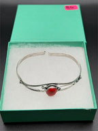 Silver plated bangle gem bracelet with handcrafted design, featuring intricate details and vibrant gemstones from Republic Mercantile.