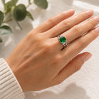 Sterling silver oval cut Helenite gemstone solitaire ring in size 8, featuring a polished band and a vibrant green gemstone.