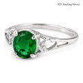 Sterling silver oval cut Helenite solitaire gemstone ring size 8, featuring a polished silver band with a vibrant green gemstone.
