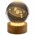 Laser etched crystal ball with universe design on LED stand by Republic Mercantile, showcasing detailed cosmic artwork.