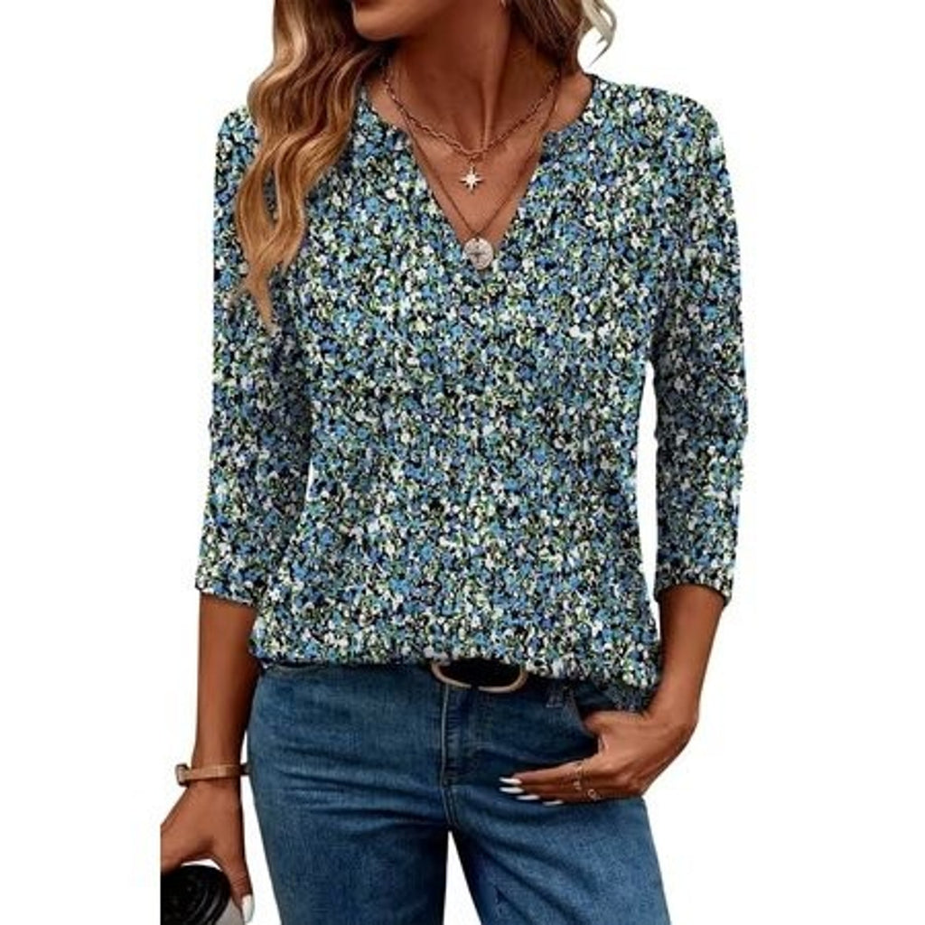 Ronuti women's 3/4 sleeve V-neck tunic blouse with loose fit and curved hem, displayed on a mannequin in size M.