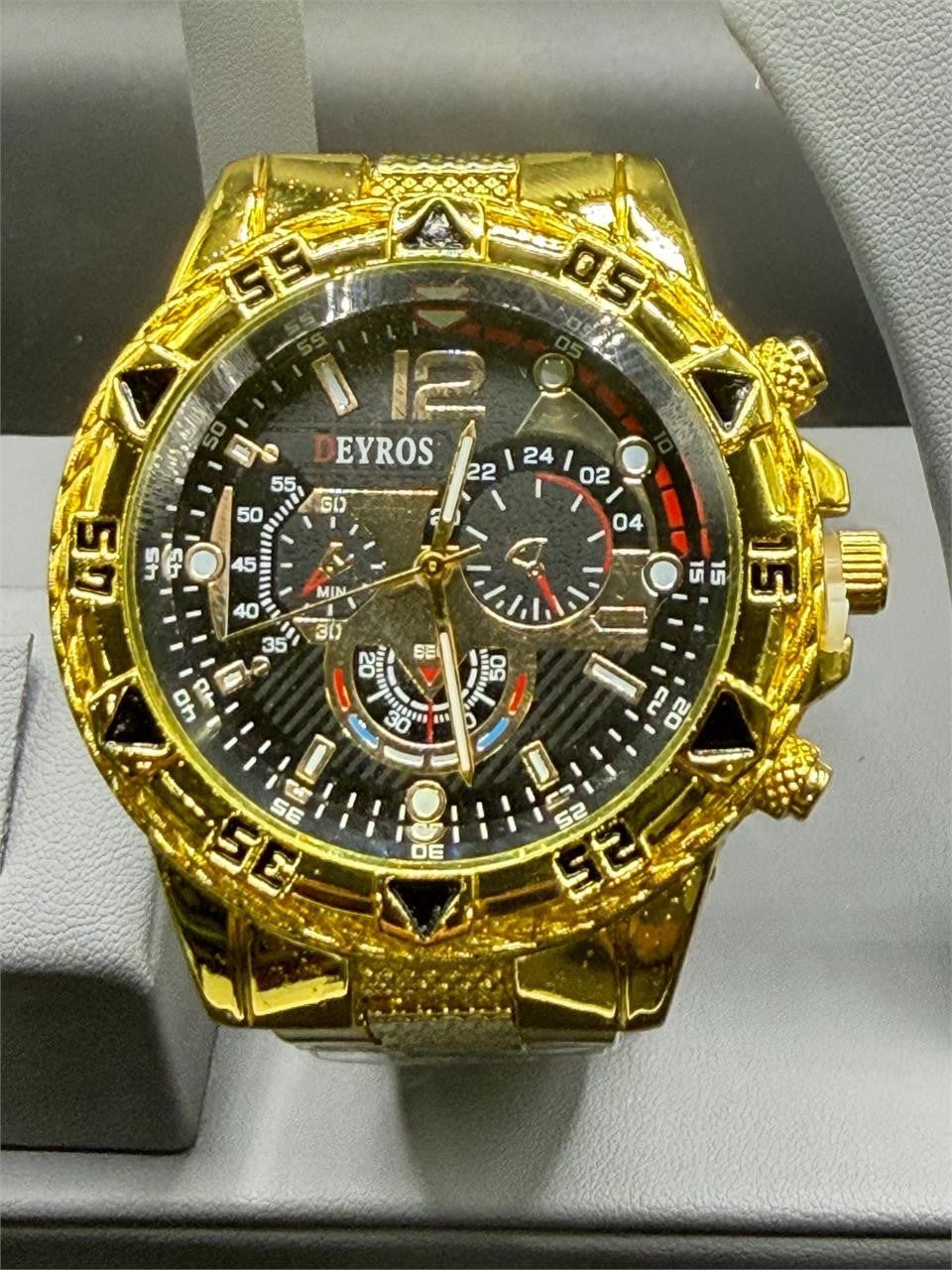 Men's Deyros gold watch with matching band by Republic Mercantile, featuring a round dial and classic gold finish.