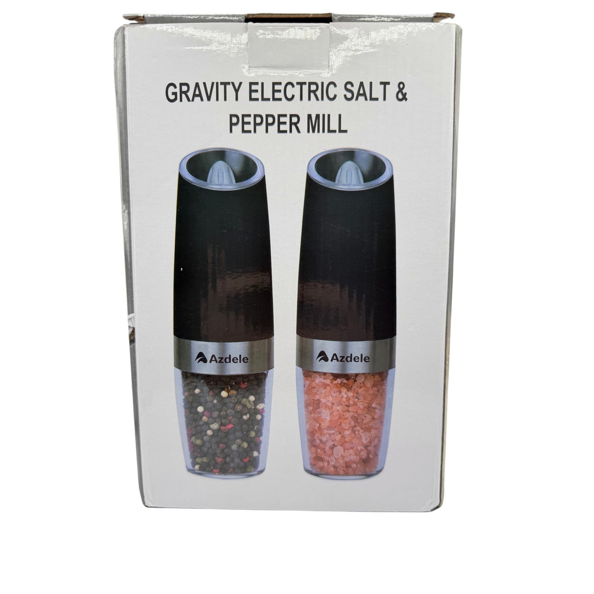Azdele Gravity Electric Salt and Pepper Mill Set with black and stainless steel design on a kitchen countertop.