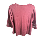 WellSize women's plus size burgundy top with 3/4 lace sleeves and V-neck in XL, shown on a model.