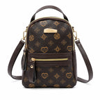 Brown Aohao heart-shaped crossbody faux leather backpack with zipper closure and adjustable strap, stylish and compact bag.