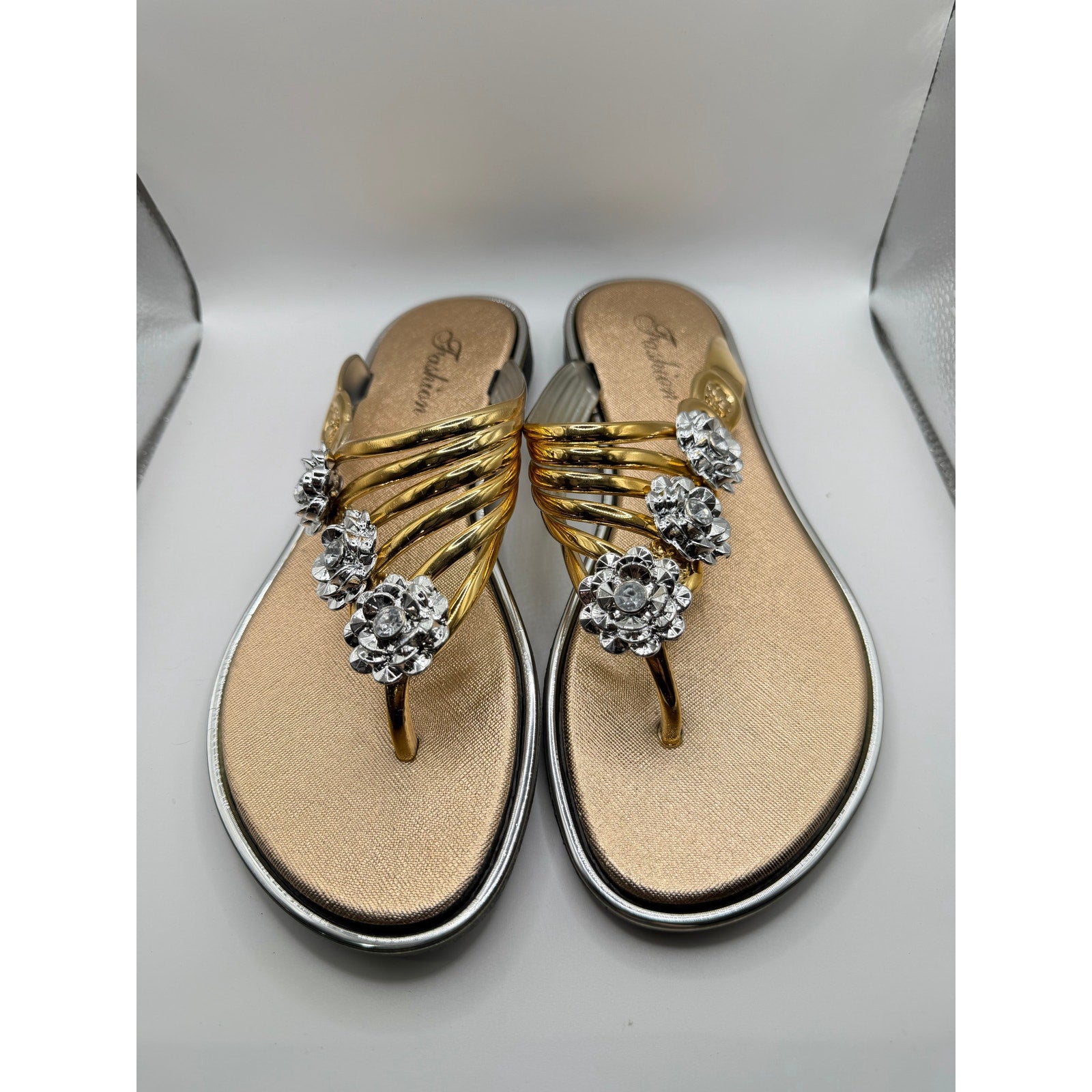 Bejeweled women's gold sandals by Republic Mercantile with bling accents, size US 9-9.5, featuring sparkling straps and comfortable design.