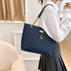 Sandglass Women's casual shoulder tote bag in blue, featuring a stylish design with sturdy handles and spacious interior.