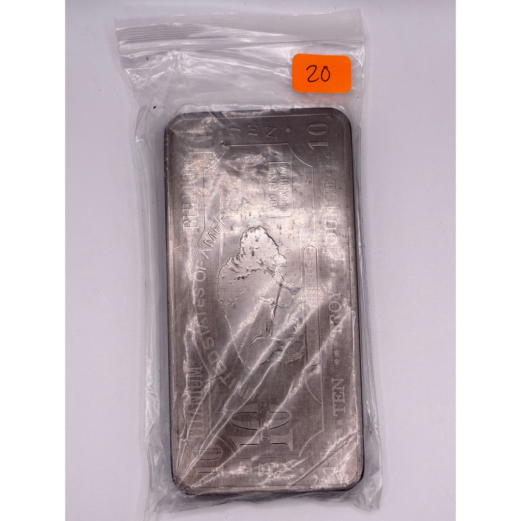 Ten Troy oz .999 fine titanium collectible bar from CMC Mint with detailed engravings and sleek metallic finish.