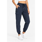 Rosvigor women's navy cargo hiking pants showing lightweight jogger design with multiple pockets, size M, casual outdoor style