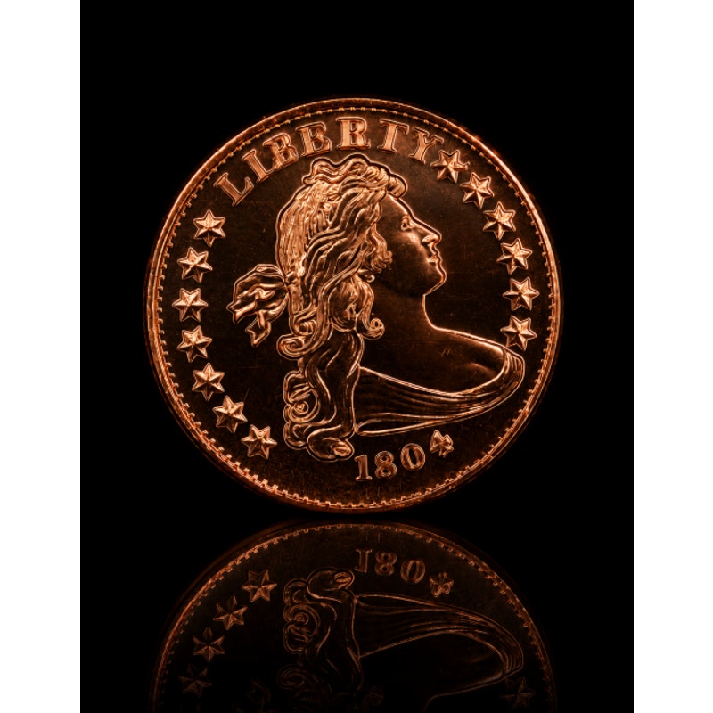 Republic Mercantile 1 oz .999 fine copper collectible coin featuring the 1804 bust design on a detailed coin.