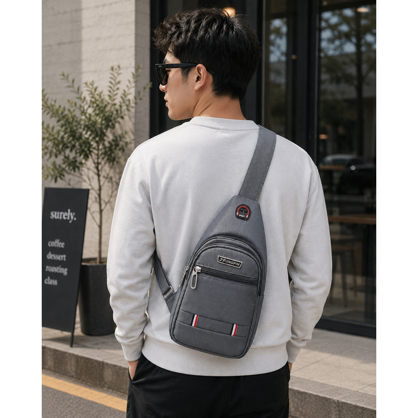 Gray Jingpin Daily Single Strap Crossbody Backpack for unisex use, showing the sleek design and adjustable strap.