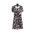 Fantaslook black floral dress in size M displayed on a hanger, featuring long sleeves and a flowy silhouette.