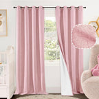 Baby pink nursery blackout curtains with 2 panels and grommet top, measuring 52x84 inches, by Lajode, hanging in a cozy nursery.