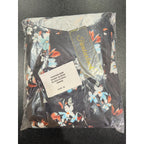 Fantaslook black floral dress in size M, featuring a fitted bodice and flowy skirt with vibrant floral pattern.